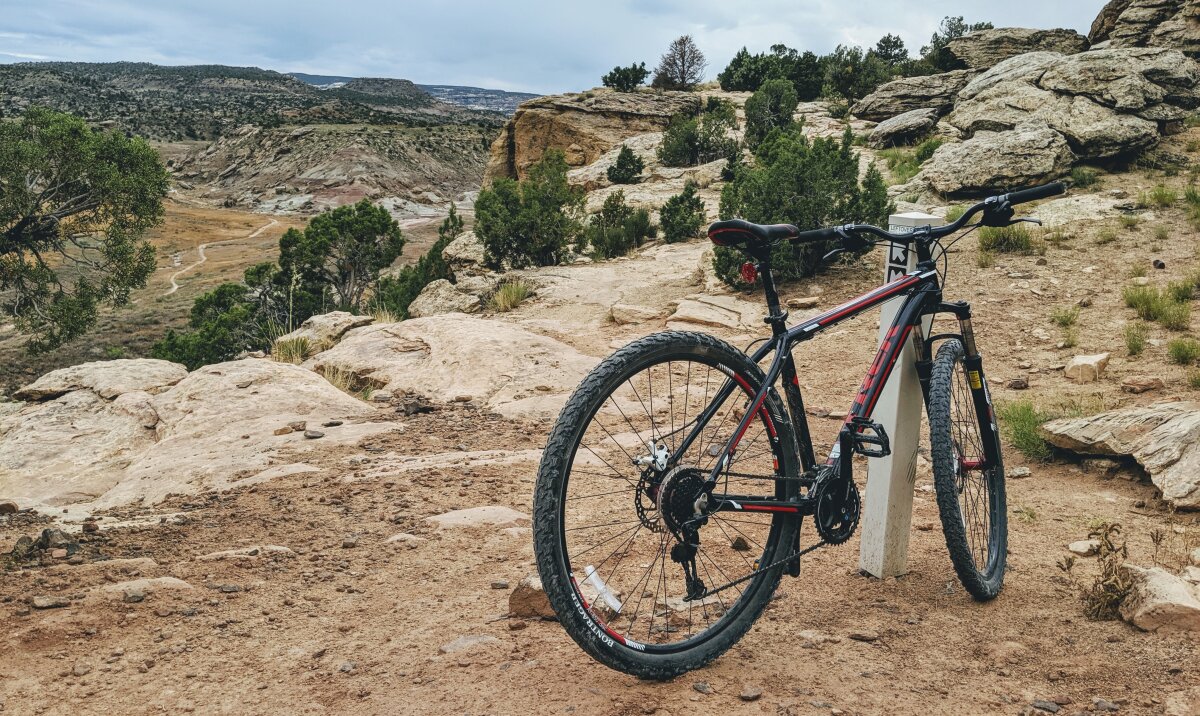 Bike standing at trail intersection